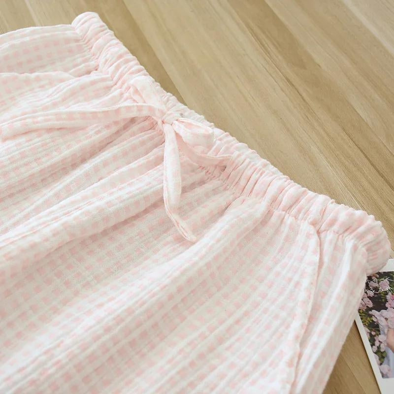 Pantalon de pyjama fluide pour femme de couleur rose clair à carreaux